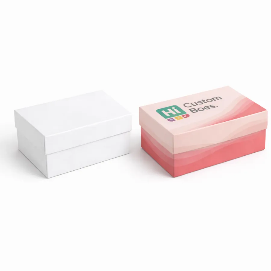 Two closed two-piece rigid boxes- one plain white and one with pink waves and brand logo- class=